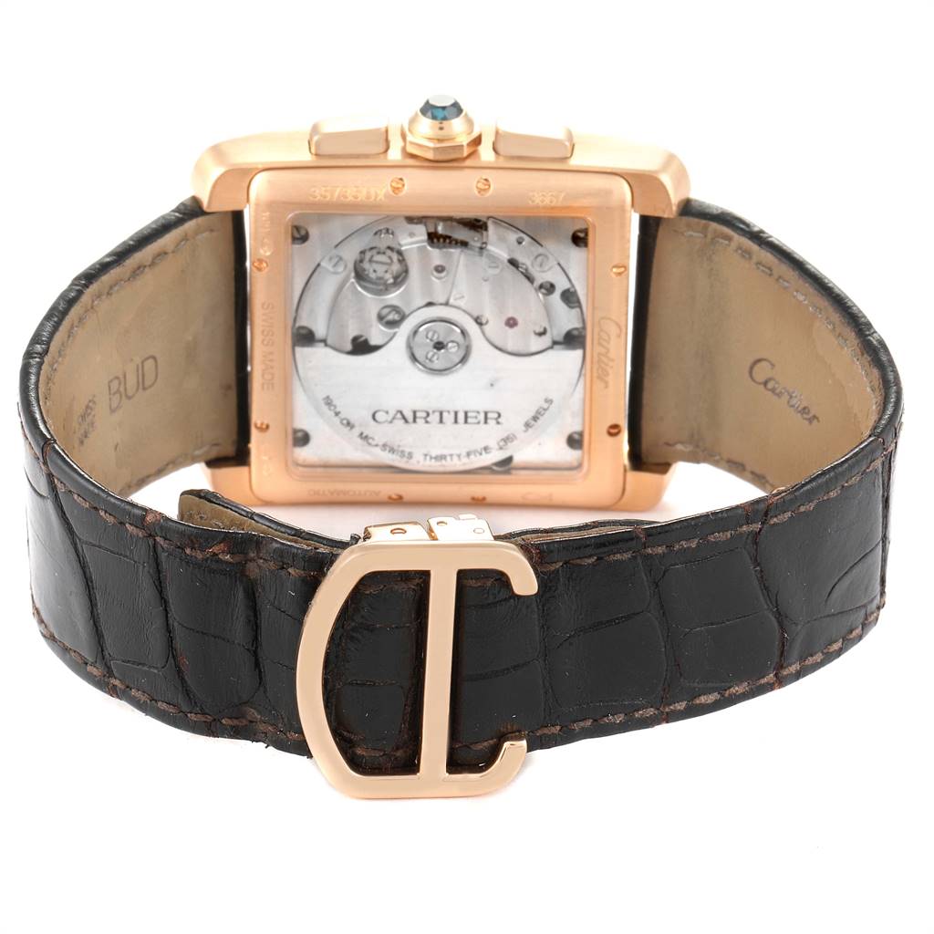 The image shows the back view of the Cartier Tank MC W5330005 Men's Rose Gold Silver Dial W5330005 Men's Rose Gold Silver Dial watch, highlighting the movement and leather strap with a distinctive buckle.