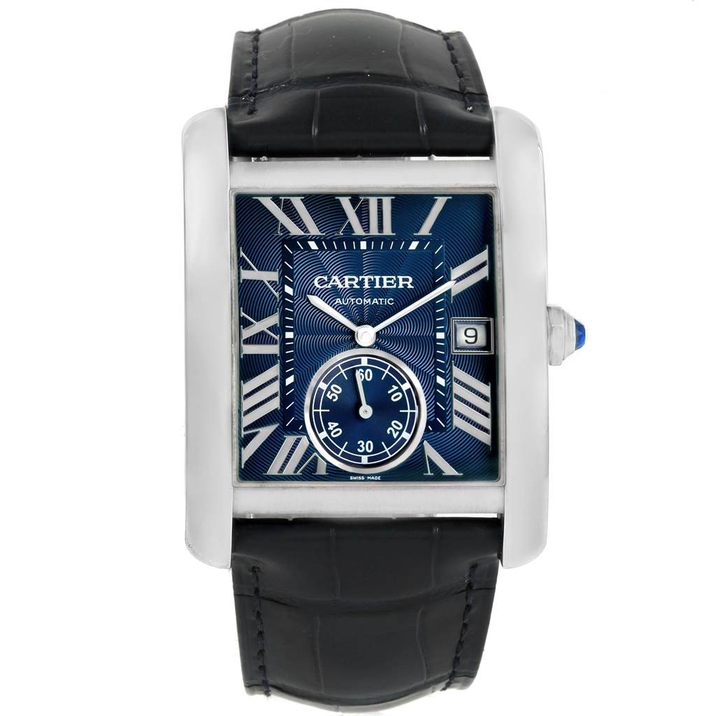 The Cartier Tank MC WSTA0010 Men's Stainless Steel Blue Dial WSTA0010 Men's Stainless Steel Blue Dial watch is shown from a front angle, displaying its face, Roman numerals, and black leather strap.