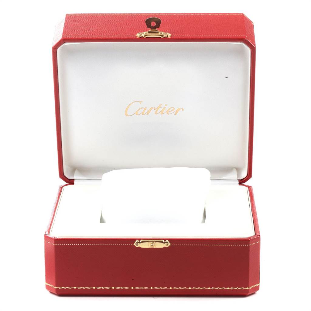 The image shows an open Cartier watch box for the Tank MC model, displaying the interior with a cushion for the watch.