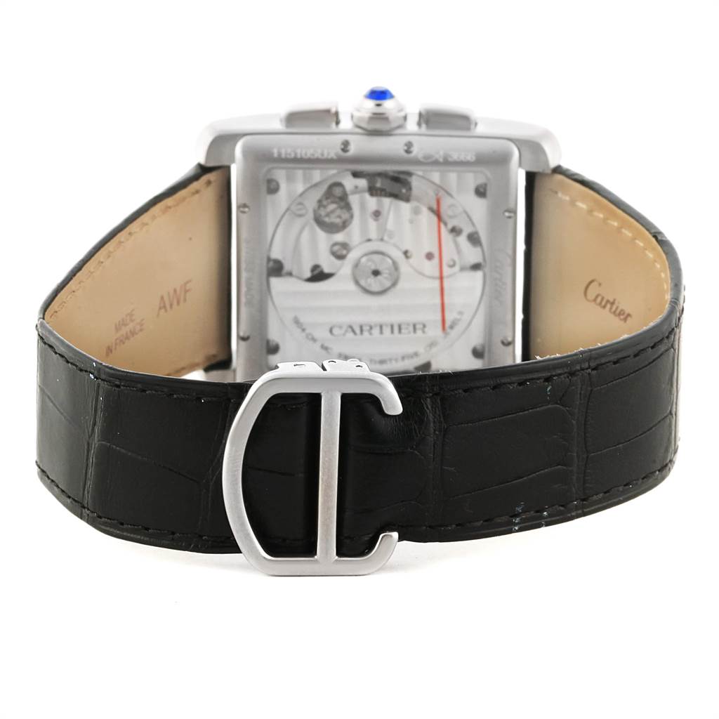 The image shows the back of a Cartier Tank MC W5330007 Men's Stainless Steel Silver Dial W5330007 Men's Stainless Steel Silver Dial watch, highlighting the movement and the black leather strap with a "C" clasp.