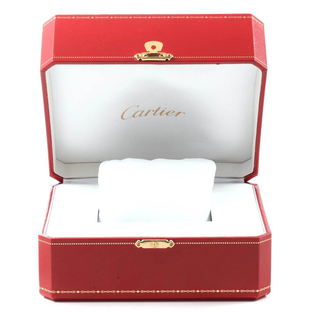 The image shows an open red Cartier box, likely for the Tank MC model watch, with a white interior and a watch cushion.