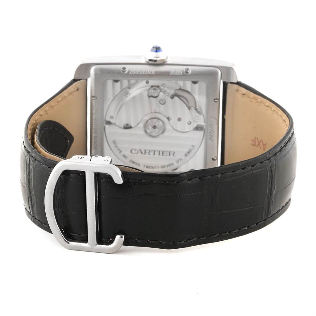 The image shows the back view of a Cartier Tank MC WSTA0010 Men's Stainless Steel Blue Dial WSTA0010 Men's Stainless Steel Blue Dial watch, highlighting its movement and leather strap with a clasp.