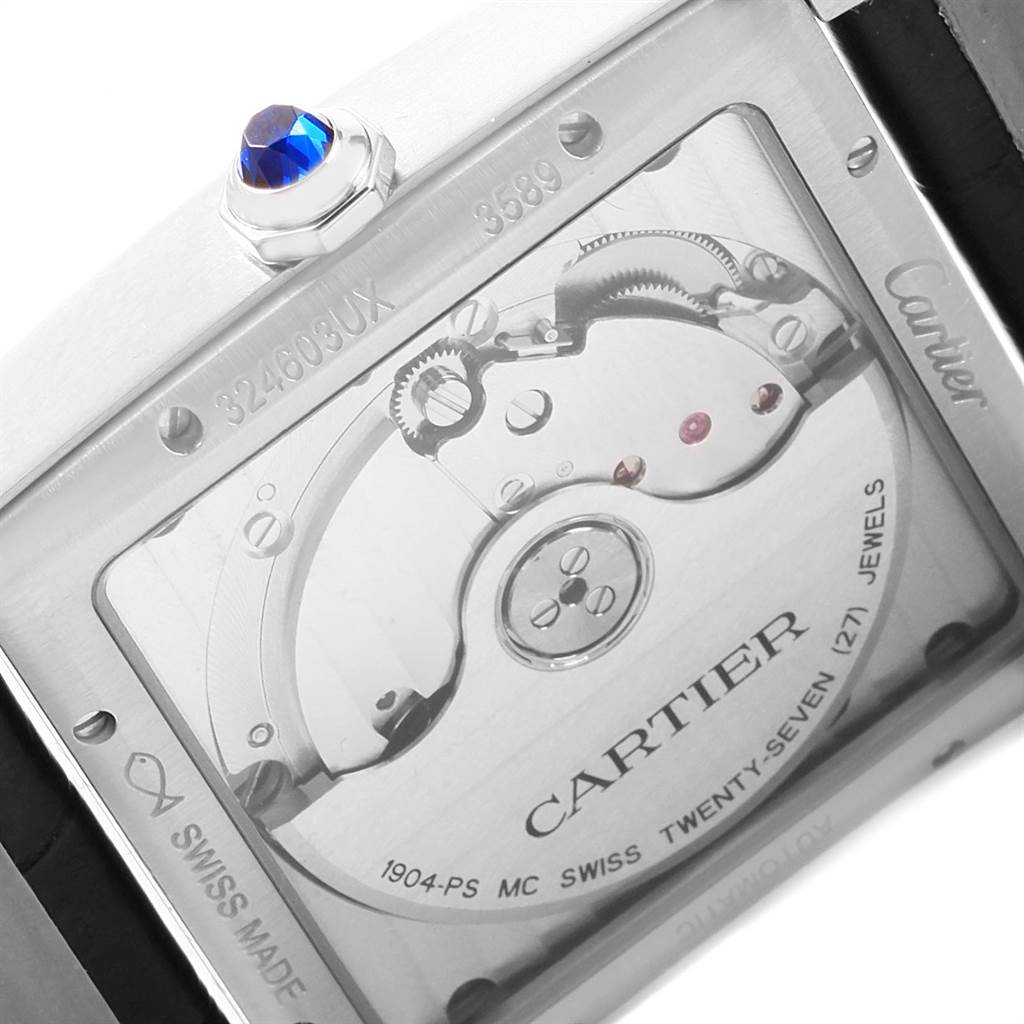 The image shows the case back and internal mechanism of a Cartier Tank MC W5330003 Men's Stainless Steel Silver Dial W5330003 Men's Stainless Steel Silver Dial watch, including the movement and inscription.