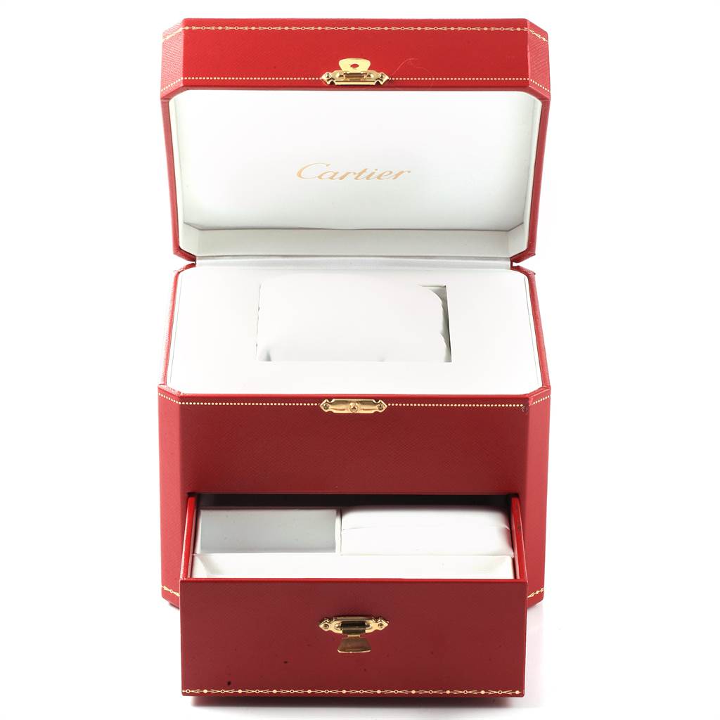 The image shows an open Cartier watch box for the Tank MC model with two compartments.