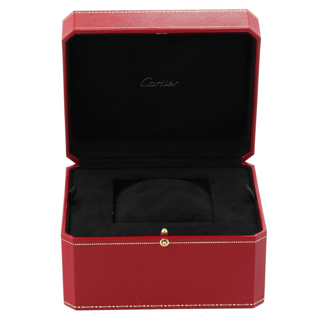 The image displays an open red Cartier box for the Tank MC model watch, showing the interior with a black cushion.