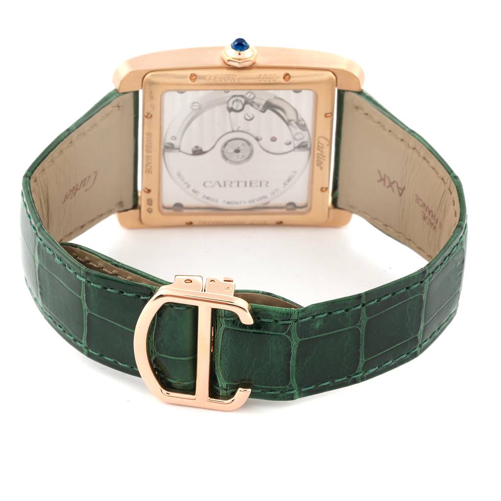 The image shows the back view of the Cartier Tank MC W5330002 Men's Rose Gold Brown Dial W5330002 Men's Rose Gold Brown Dial watch, displaying its movement and green leather strap with buckle.