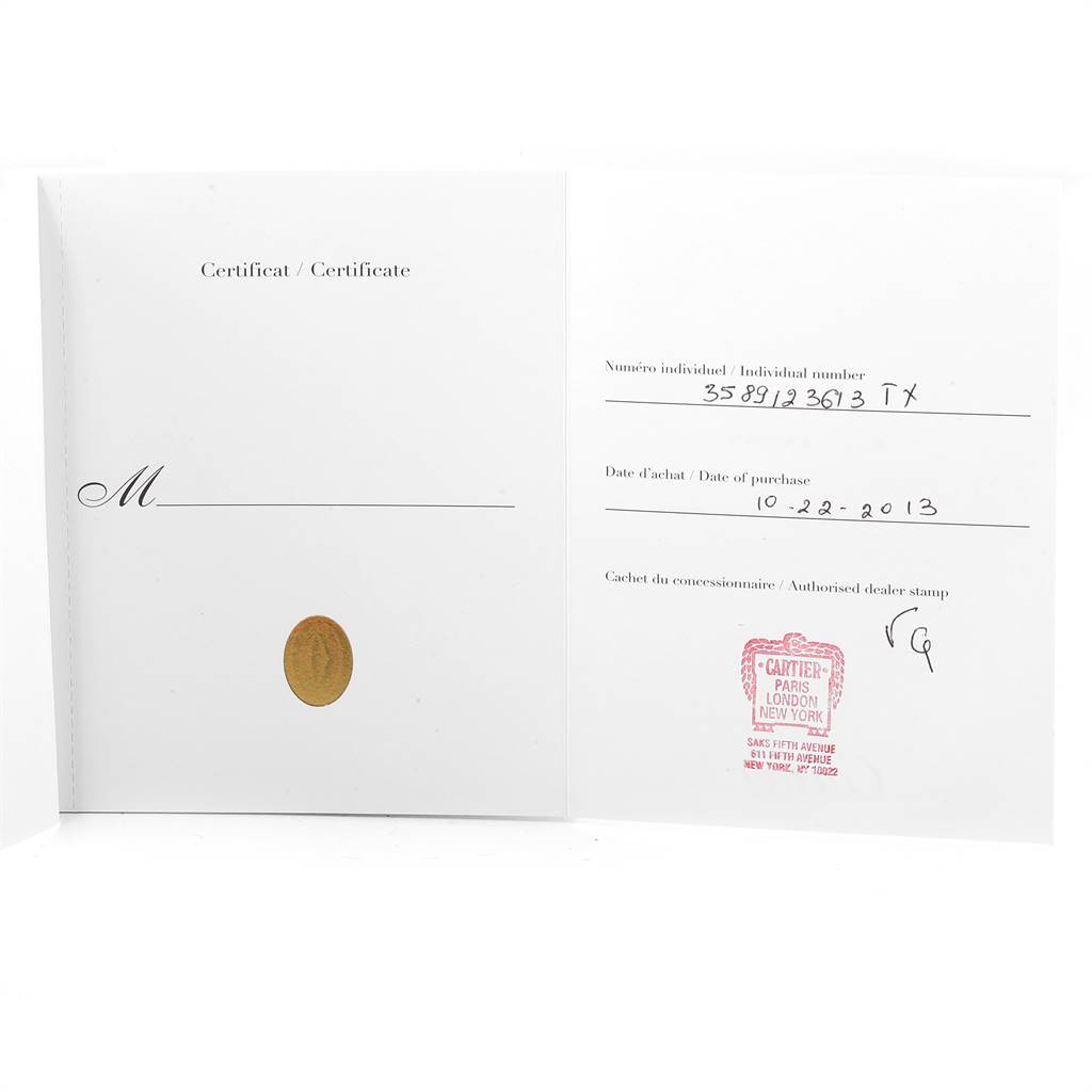 The image shows the certificate of authenticity for a Cartier Tank MC W5330003 Men's Stainless Steel Silver Dial W5330003 Men's Stainless Steel Silver Dial model watch, including purchase date and dealer stamp.