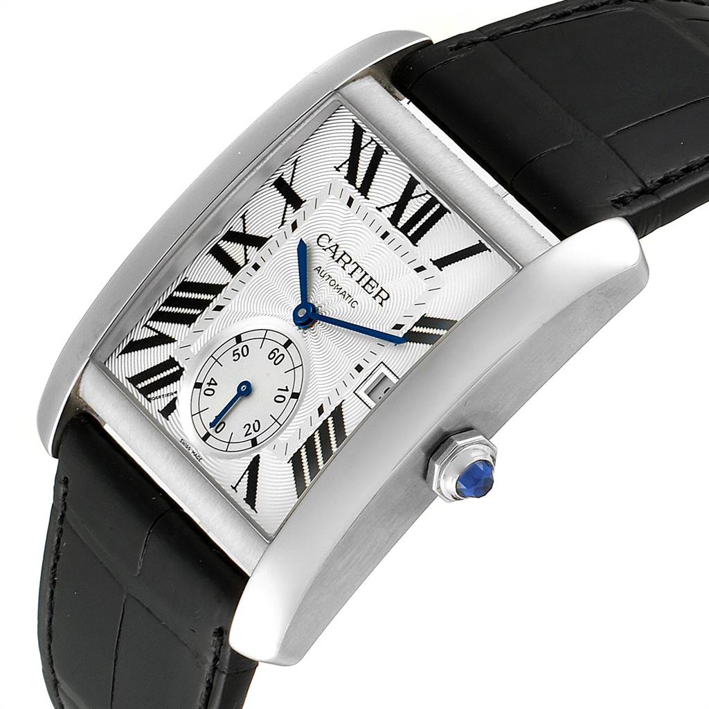 The image shows the Cartier Tank MC W5330003 Men's Stainless Steel Silver Dial W5330003 Men's Stainless Steel Silver Dial watch from an angled top-down view, highlighting its face, crown, and black leather strap.