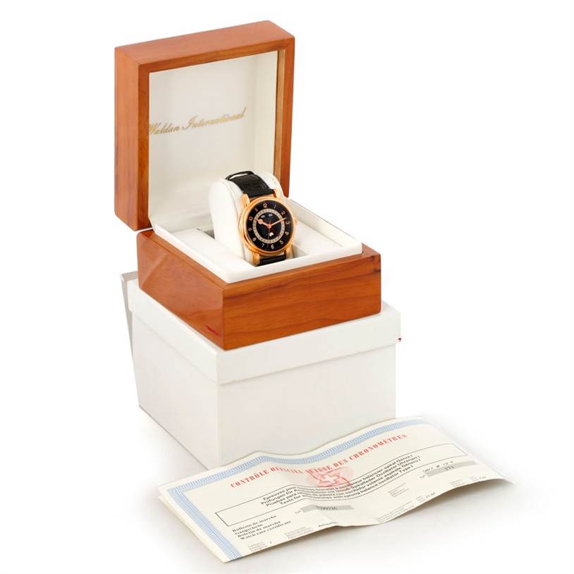 The Astronic Triple Date Moonphase 18K Rose Gold Watch by Waldan Men's Rose Gold Black Dial Men's Rose Gold Black Dial is shown at a slight angle in an open wooden box with certification papers.