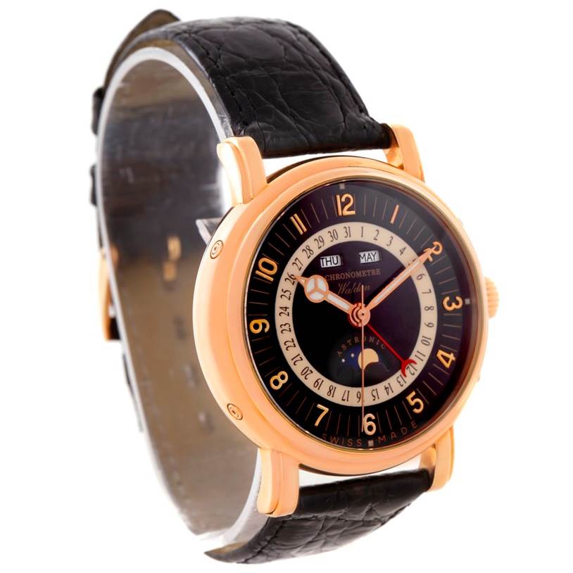 The image shows a Waldan Men's Rose Gold Black Dial Men's Rose Gold Black Dial Astronic Triple Date Moonphase 18K Rose Gold Watch from a three-quarter view, displaying the face, case, and strap.