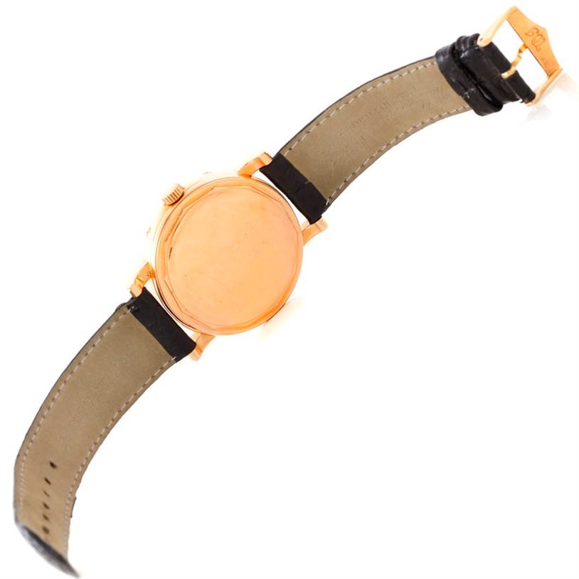 The image shows the back case and strap of the Waldan Men's Rose Gold Black Dial Men's Rose Gold Black Dial Astronic Triple Date Moonphase 18K Rose Gold Watch from a top-down angle.