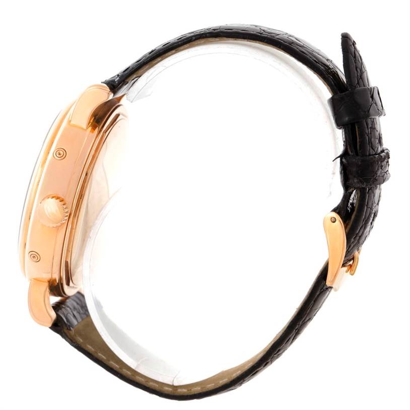 The image shows a side view of the Waldan Men's Rose Gold Black Dial Men's Rose Gold Black Dial Astronic Triple Date Moonphase 18K Rose Gold Watch, highlighting the crown and part of the strap.