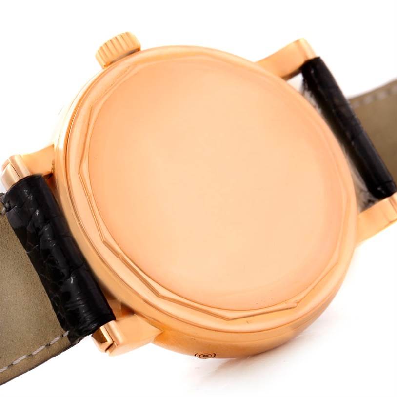 The image shows the back casing and part of the strap of the Waldan Men's Rose Gold Black Dial Men's Rose Gold Black Dial Astronic Triple Date Moonphase 18K Rose Gold Watch.