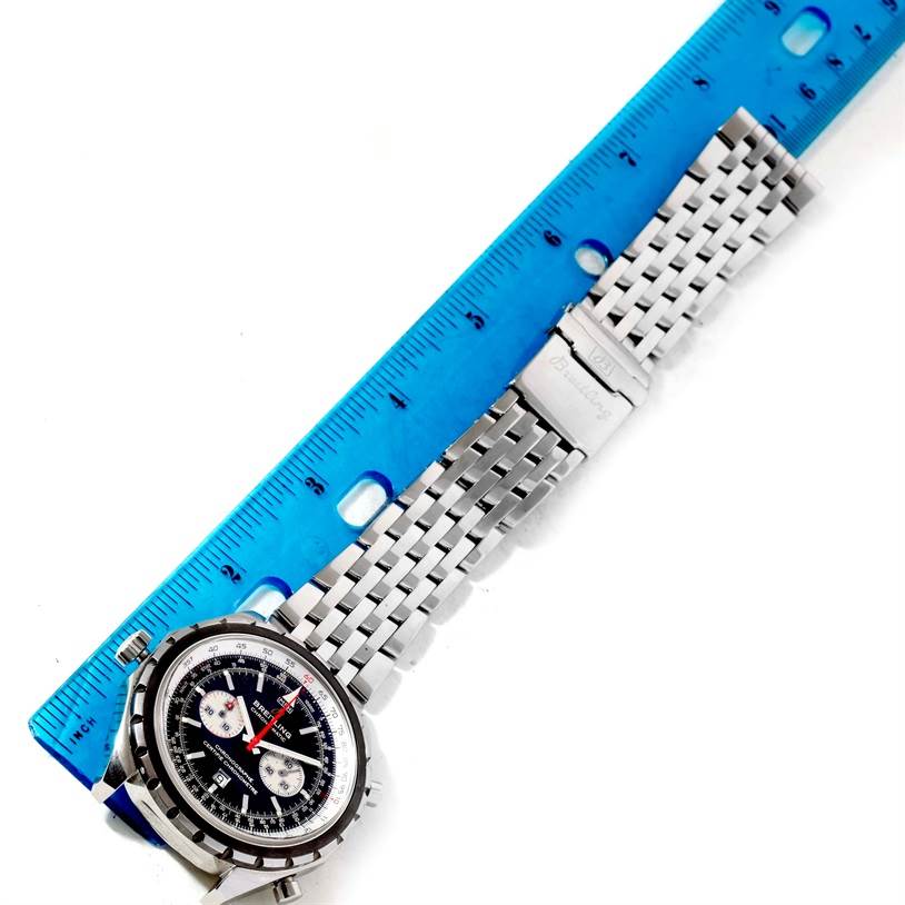The image shows the face and metal strap of the Breitling Chronomatic A41360 Men's Stainless Steel Black Dial A41360 Men's Stainless Steel Black Dial watch, positioned next to a blue ruler.