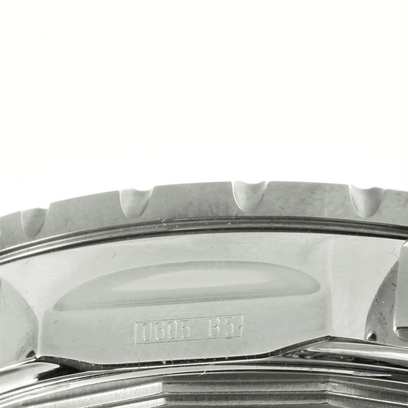 The image shows a close-up of the bezel and case back of a Breitling Chronomatic A41360 Men's Stainless Steel Black Dial A41360 Men's Stainless Steel Black Dial watch.