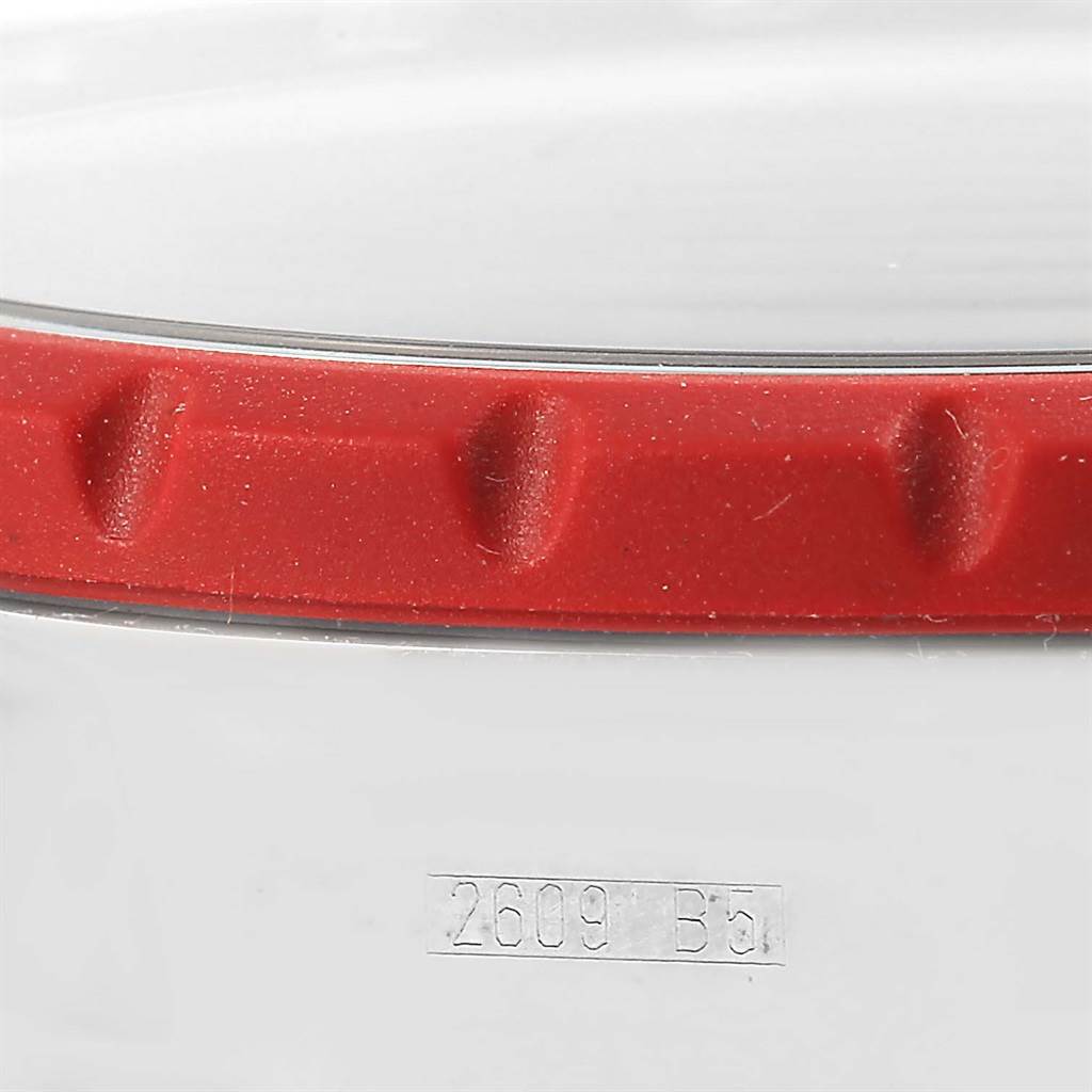 This image shows a close-up of a part of the Breitling Chronomatic A19360 Men's Stainless Steel Black Dial A19360 Men's Stainless Steel Black Dial watch, specifically the red bezel and the engraved model number.