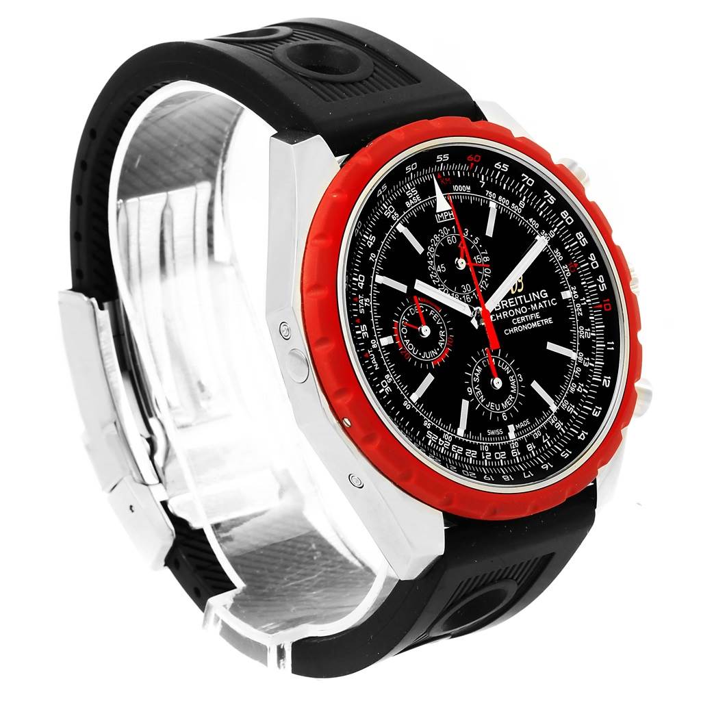 The image shows a Chronomatic model by Breitling from a side angle, highlighting the black dial, red bezel, and black rubber strap.