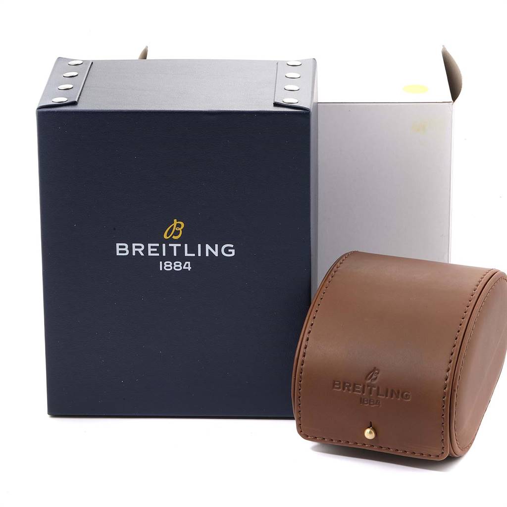 The image displays the packaging for a Breitling Chronomatic A19360 Men's Stainless Steel Black Dial A19360 Men's Stainless Steel Black Dial watch, featuring a blue box and a brown leather travel case.
