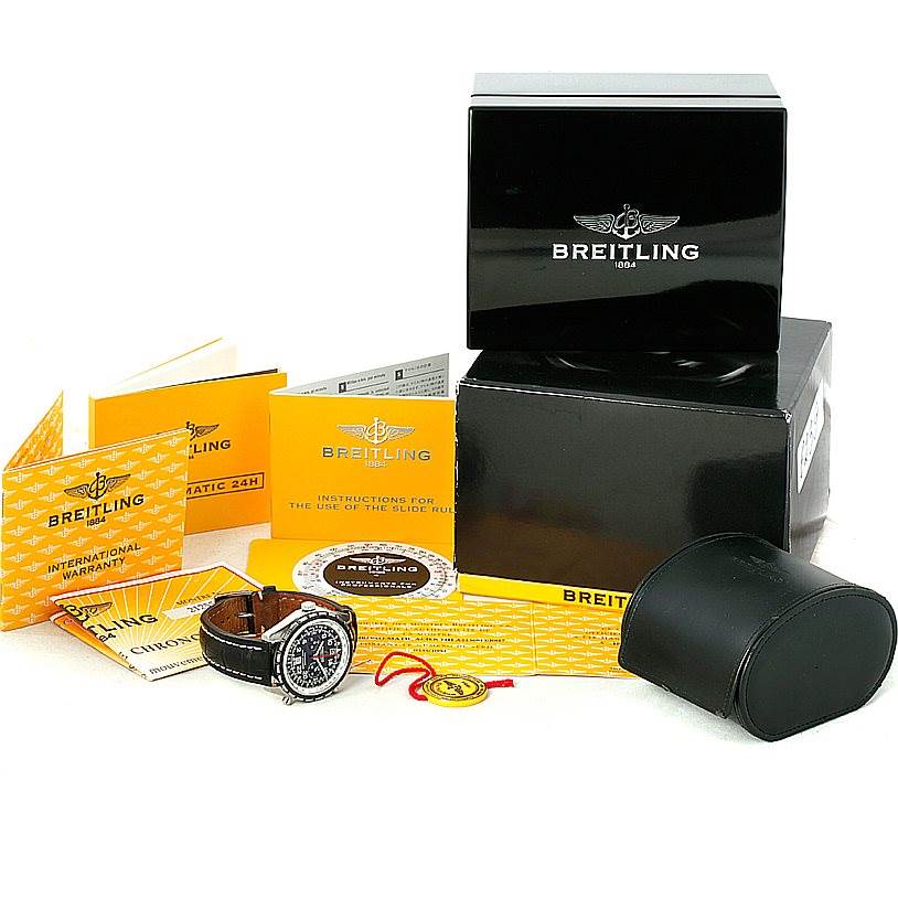 The image shows a Breitling Chronomatic A22360 Men's Stainless Steel Black Dial A22360 Men's Stainless Steel Black Dial watch and accessories including packaging, manuals, warranty, and a carrying case.