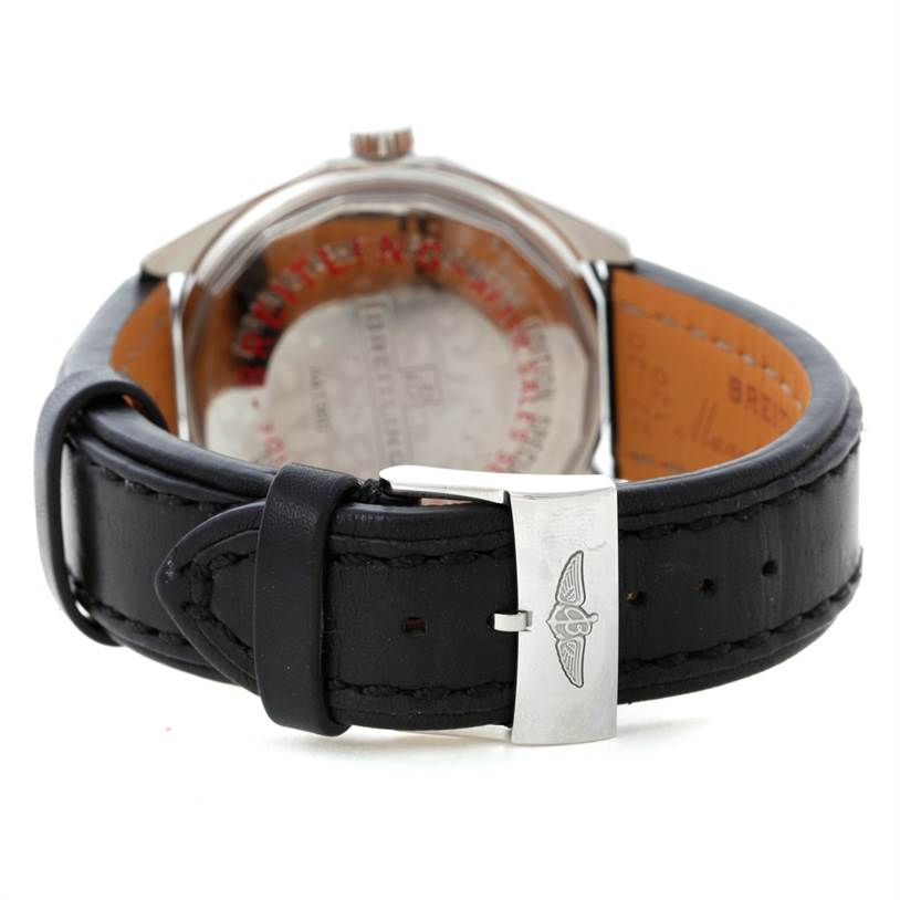 The image shows the back of a Breitling Chronomatic A41360 Men's Stainless Steel Black Dial A41360 Men's Stainless Steel Black Dial watch, highlighting the black leather strap and silver clasp with the Breitling logo.