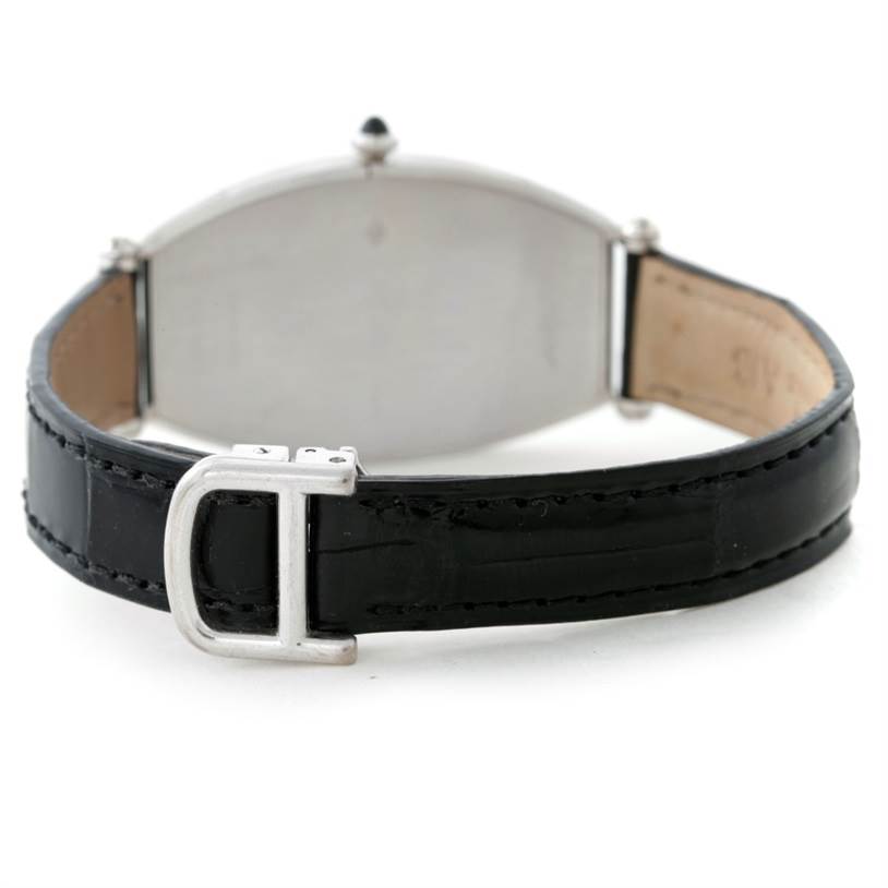 The image shows the back view of the Cartier Tonneau W1546351 Women's Platinum Silver Dial W1546351 Women's Platinum Silver Dial model watch with a black leather strap and its metal buckle.