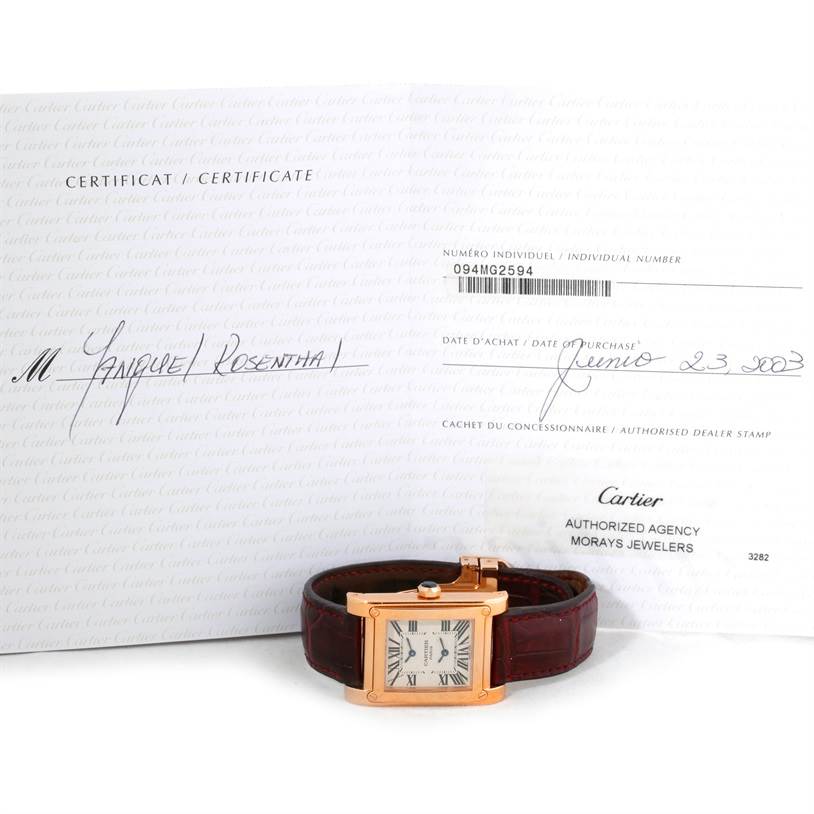 The image shows a Cartier Tank A Vis W1537651 Men's Rose Gold Silver Dial W1537651 Men's Rose Gold Silver Dial watch positioned in front of its certificate.