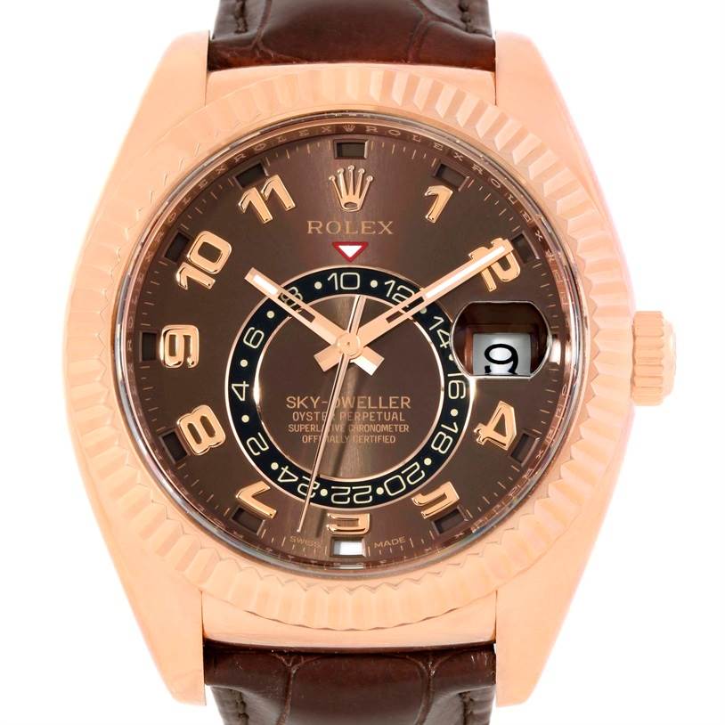 This image shows a front view of a Rolex Sky-Dweller 326135 Men's Rose Gold Brown Dial 326135 Men's Rose Gold Brown Dial watch, highlighting its dial, bezel, crown, and brown leather strap.