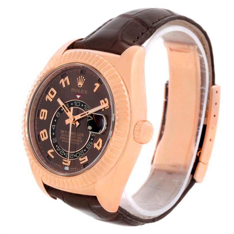 The image shows a side-angle view of a Rolex Sky-Dweller 326135 Men's Rose Gold Brown Dial 326135 Men's Rose Gold Brown Dial watch, highlighting its dial, crown, and leather strap.