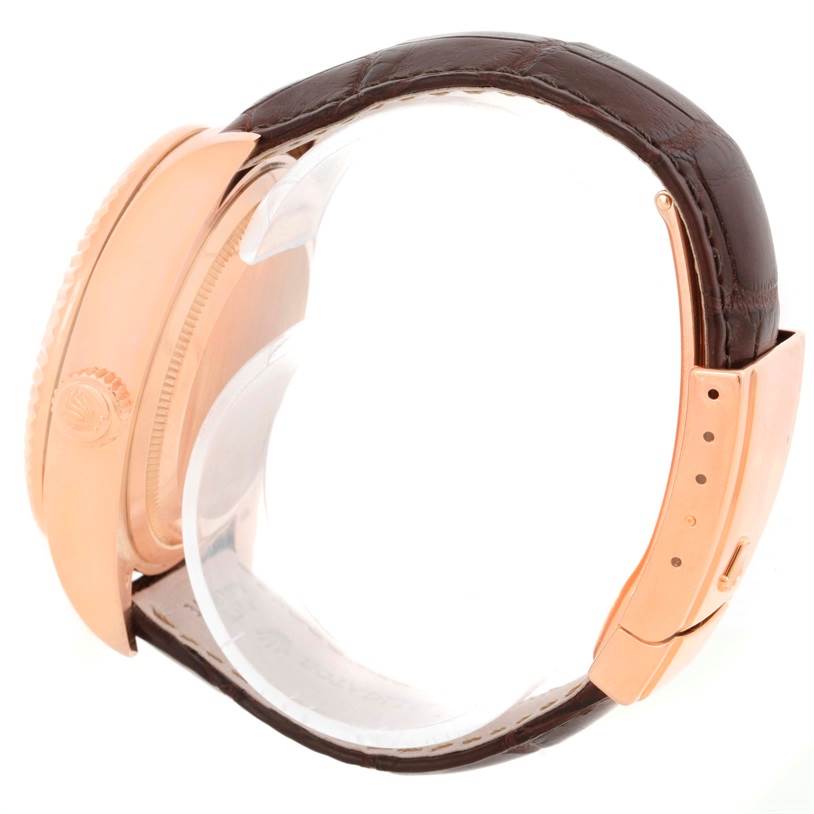 The image shows a side view of a Rolex Sky-Dweller 326135 Men's Rose Gold Brown Dial 326135 Men's Rose Gold Brown Dial watch, focusing on the case, crown, and leather strap.