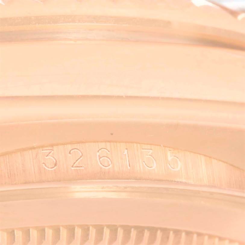This close-up image shows the model number "326135" engraved on the case of the Rolex Sky-Dweller 326135 Men's Rose Gold Brown Dial 326135 Men's Rose Gold Brown Dial watch.