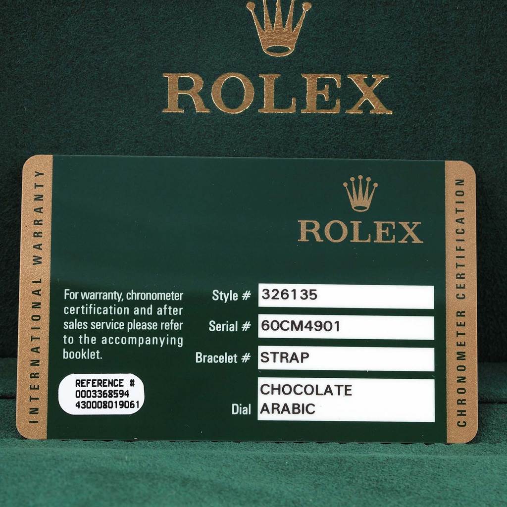 The image shows a Rolex Sky-Dweller 326135 Men's Rose Gold Brown Dial 326135 Men's Rose Gold Brown Dial warranty card with model details, featuring style #326135 and a chocolate Arabic dial.