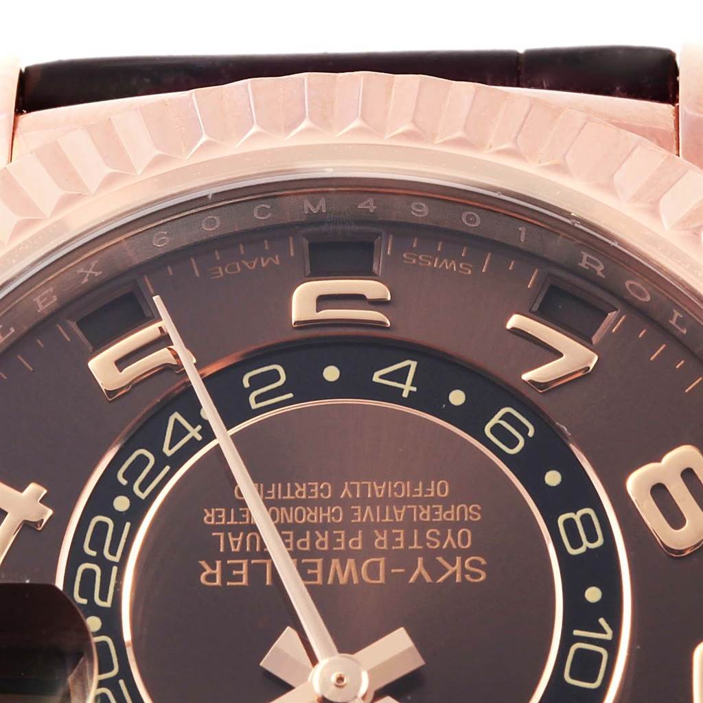 The image shows a close-up view of the dial, hands, and bezel of the Rolex Sky-Dweller 326135 Men's Rose Gold Brown Dial 326135 Men's Rose Gold Brown Dial watch.