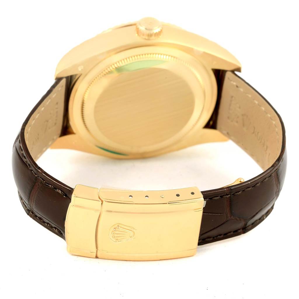 This image shows the back of a Rolex Sky-Dweller 326138 Men's Yellow Gold Champagne Dial 326138 Men's Yellow Gold Champagne Dial watch with its leather strap and clasp visible.