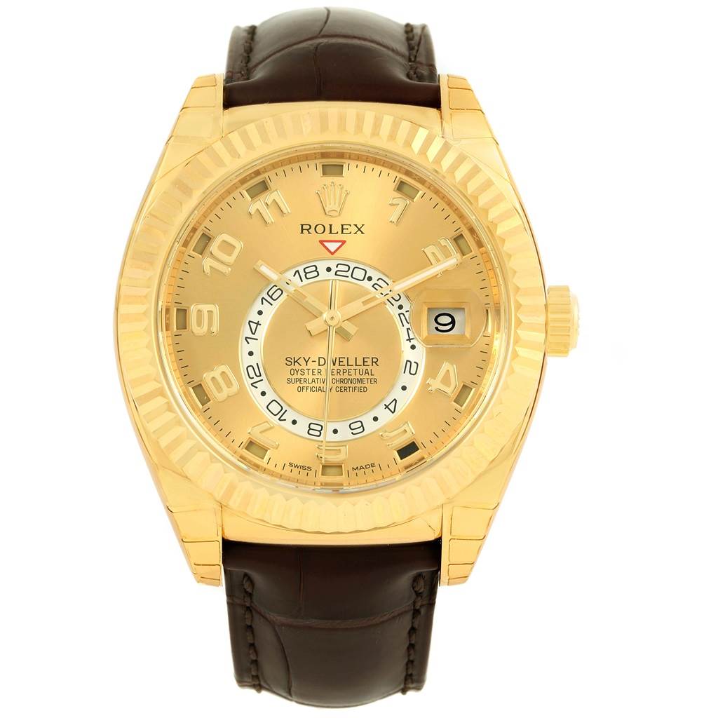 The image shows a front view of a Rolex Sky-Dweller 326138 Men's Yellow Gold Champagne Dial 326138 Men's Yellow Gold Champagne Dial watch, featuring its gold case, dial, and brown leather strap.