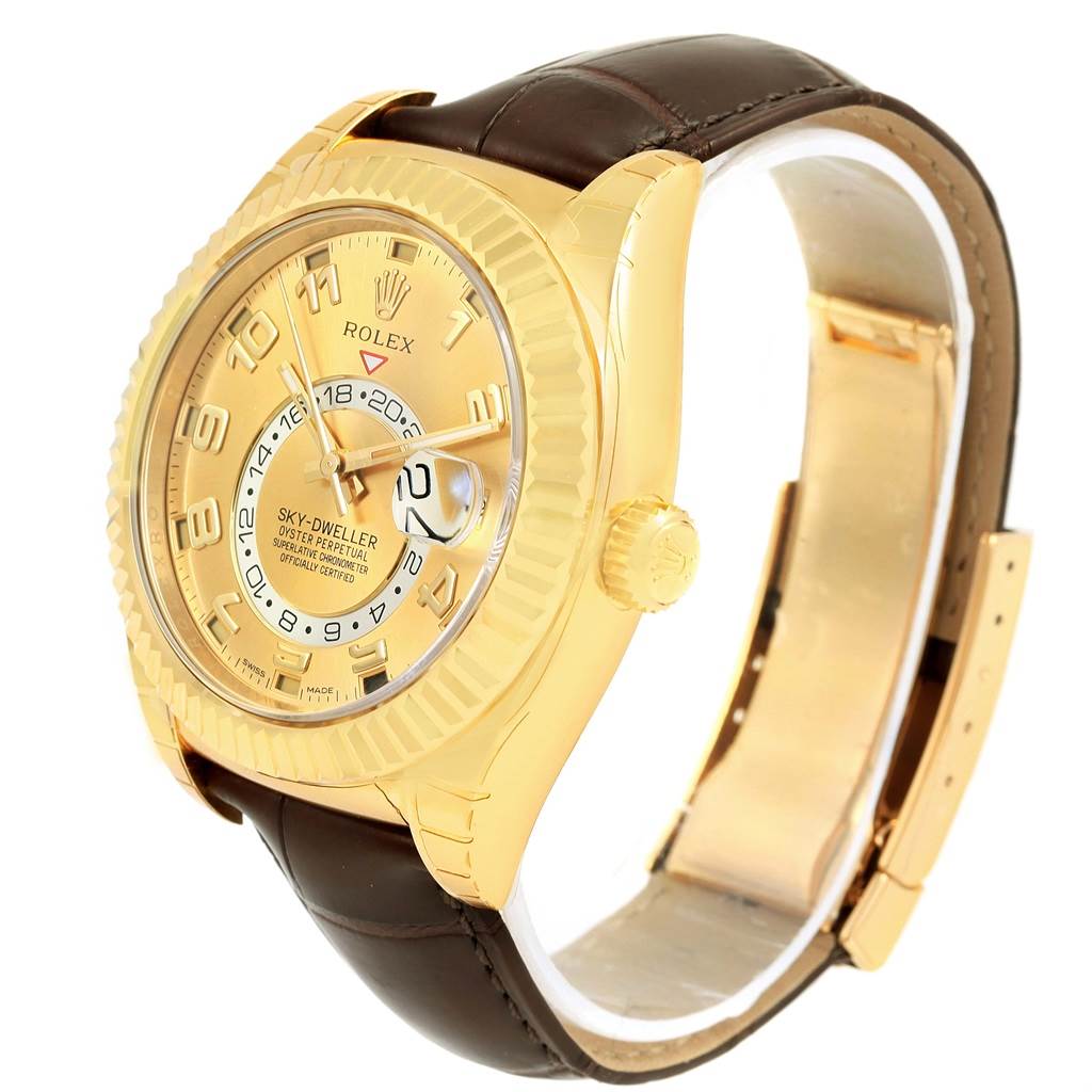 The image shows a Rolex Sky-Dweller 326138 Men's Yellow Gold Champagne Dial 326138 Men's Yellow Gold Champagne Dial watch angled to display its face, bezel, crown, and leather strap.