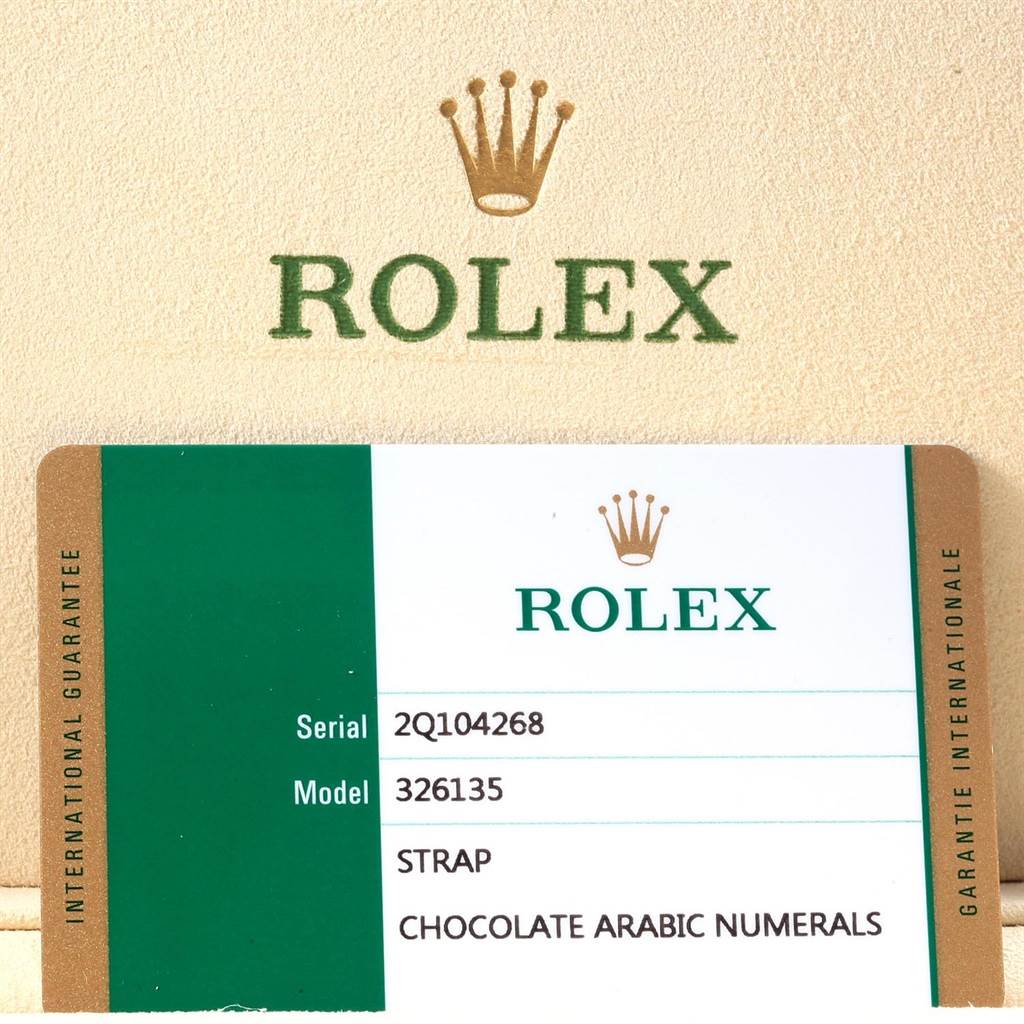 The image shows the international guarantee card for the Rolex Sky-Dweller 326135 Men's Rose Gold Brown Dial 326135 Men's Rose Gold Brown Dial model, displaying serial and model numbers.