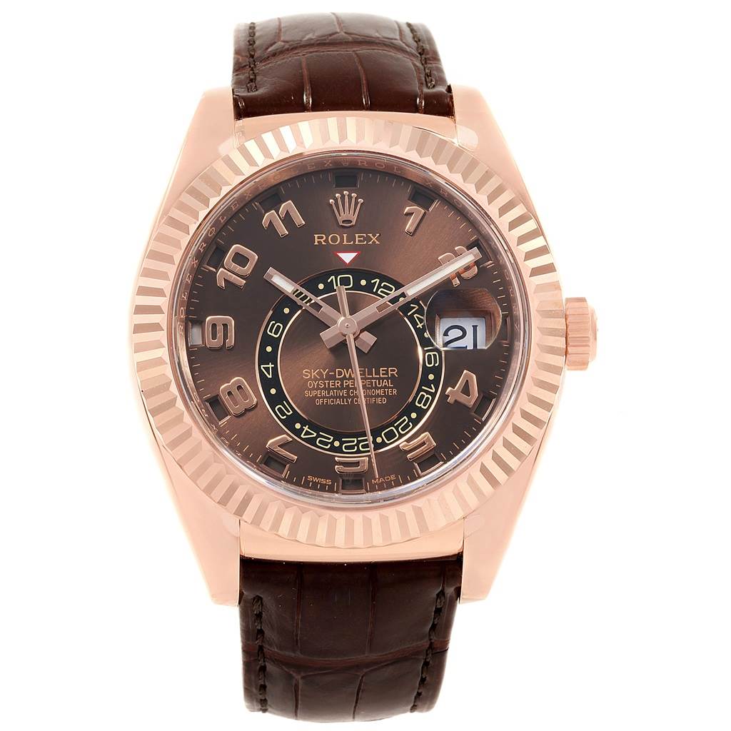 The image shows a front view of a Rolex Sky-Dweller 326135 Men's Rose Gold Brown Dial 326135 Men's Rose Gold Brown Dial watch, featuring a brown dial, gold case, and brown leather strap.