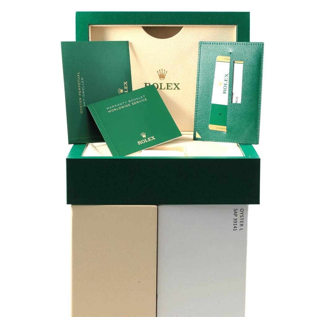 The image shows the opened packaging for a Rolex Sky-Dweller 326135 Men's Rose Gold Brown Dial 326135 Men's Rose Gold Brown Dial watch with warranty booklets and card holder displayed.