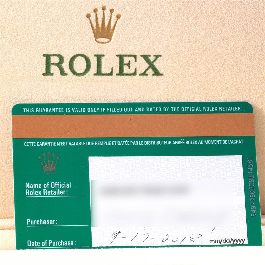 The image shows the warranty card for a Rolex Sky-Dweller 326135 Men's Rose Gold Brown Dial 326135 Men's Rose Gold Brown Dial watch, angled flat with the top of the warranty card holder also visible.