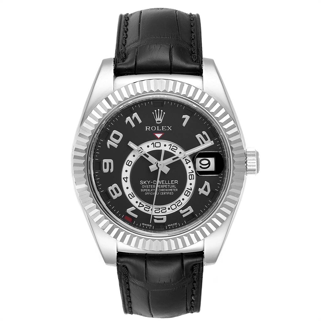 The Rolex Sky-Dweller 326139 Men's White Gold Black Dial 326139 Men's White Gold Black Dial watch is shown from the front, displaying its black dial, fluted bezel, date window, and black leather strap.