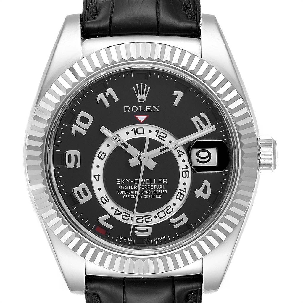 This image shows a front view of a Rolex Sky-Dweller 326139 Men's White Gold Black Dial 326139 Men's White Gold Black Dial watch, featuring its dial, bezel, hands, crown, and part of the leather strap.