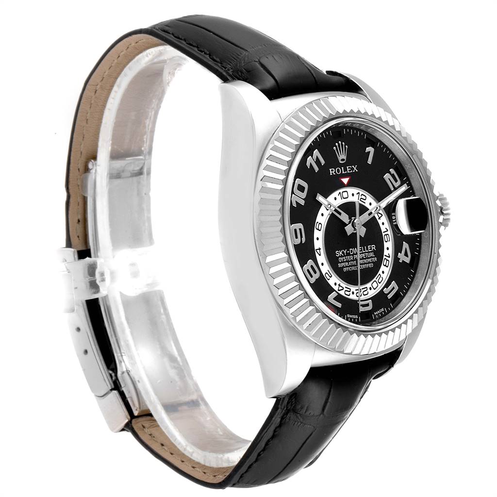 This image shows a side angle of the Rolex Sky-Dweller 326139 Men's White Gold Black Dial 326139 Men's White Gold Black Dial watch, featuring its black dial, fluted bezel, and black leather strap.