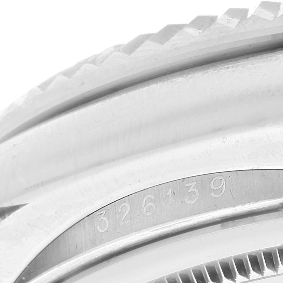 This close-up image shows the bezel with engraved numbers of a Rolex Sky-Dweller 326139 Men's White Gold Black Dial 326139 Men's White Gold Black Dial watch.