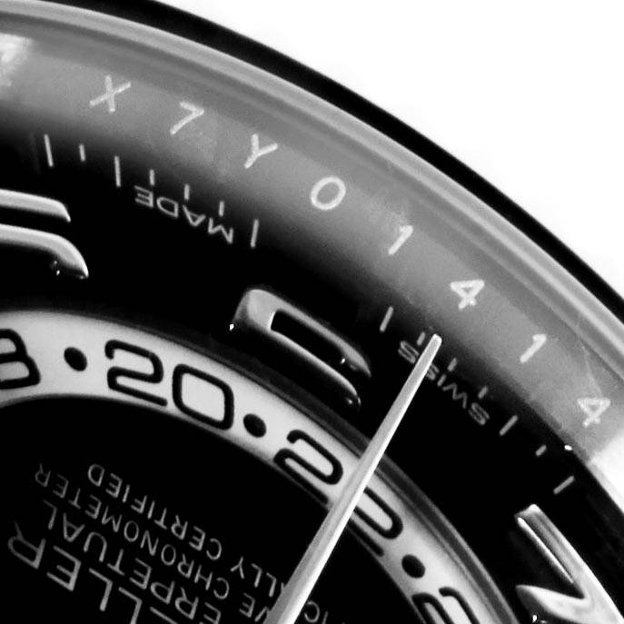 This image shows a close-up of the Rolex Sky-Dweller 326139 Men's White Gold Black Dial 326139 Men's White Gold Black Dial watch face, focusing on part of the dial and the Swiss markings.