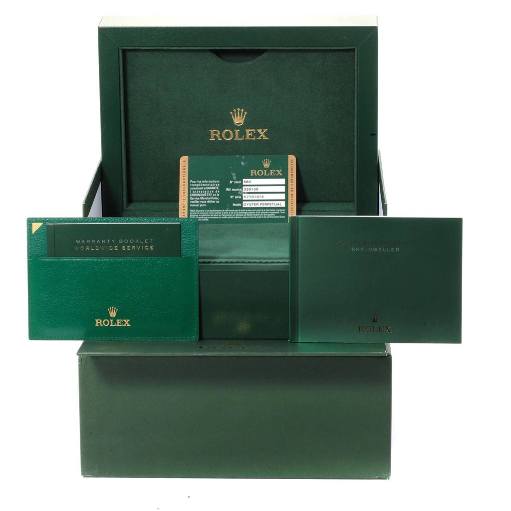 The packaging for the Sky-Dweller model by Rolex includes the display box, warranty booklet, and user manual.