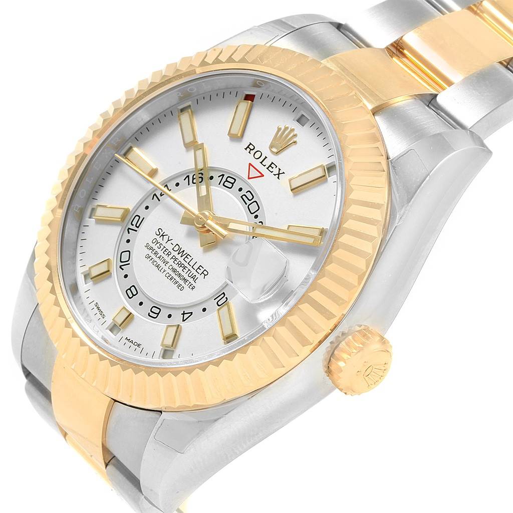 The Rolex Sky-Dweller 326933 Men's Steel and Gold (two tone) White Dial 326933 Men's Steel and Gold (two tone) White Dial watch is shown at a slight angle, capturing its face, bezel, and part of the bracelet.