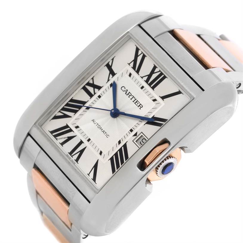 The image shows a close-up angle of the Cartier Tank Anglaise W5310006 Men
s Steel and Gold (two tone) Silver Dial W5310006 Men
s Steel and Gold (two tone) Silver Dial watch, featuring its face, blue hands, and crown with a blue cabochon.