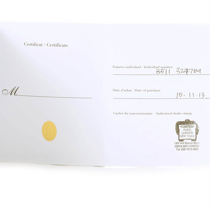 The image shows an open certificate for a Tank Anglaise model by Cartier, including individual number, date of purchase, and authorized dealer stamp.