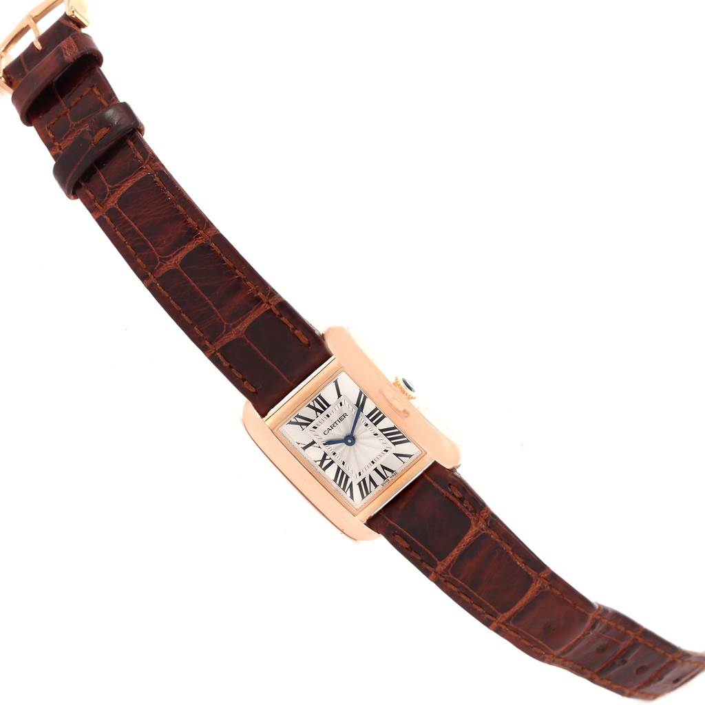 The image shows a Cartier Tank Anglaise WT100024 Women
s Rose Gold Silver Dial WT100024 Women
s Rose Gold Silver Dial watch with a brown leather strap at an angled view.