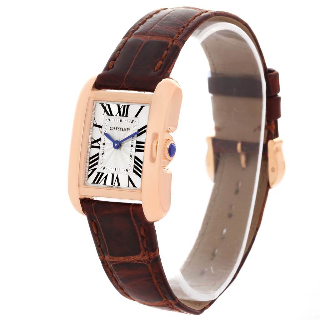 This image shows a Cartier Tank Anglaise WT100024 Women
s Rose Gold Silver Dial WT100024 Women
s Rose Gold Silver Dial watch from a three-quarter angle, highlighting its face, strap, and crown.